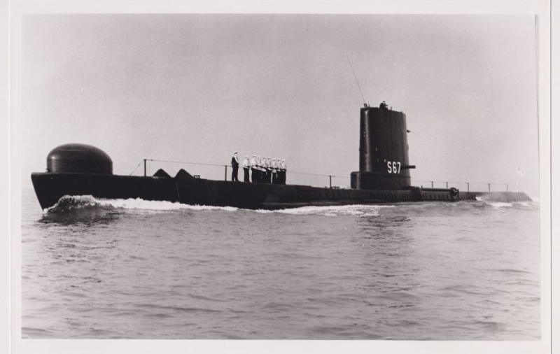 HMS Alliance breaking through the water. 
