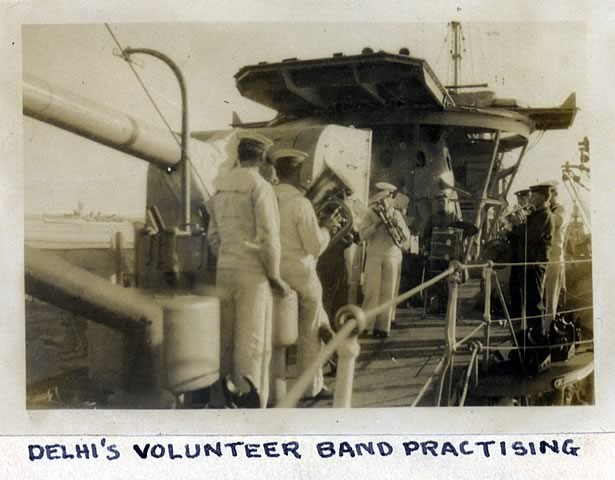 HMS Delhi's volunteer band playing on the top deck. 