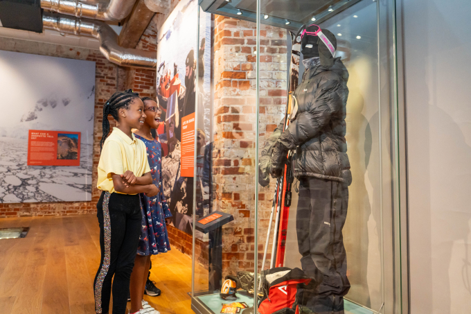Two children look at a display in the Worlds Beneath the Waves exhibition.