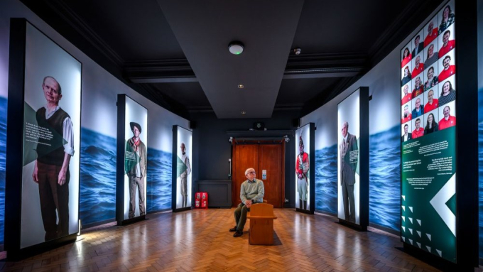 A visitors sits and learns about the legacy of the Battle of Trafalgar. 