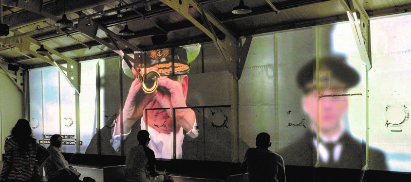 The story of HMS Caroline projected onto her interior walls. 