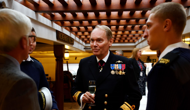 Naval officers enjoying drinks onboard HMS Victory. 