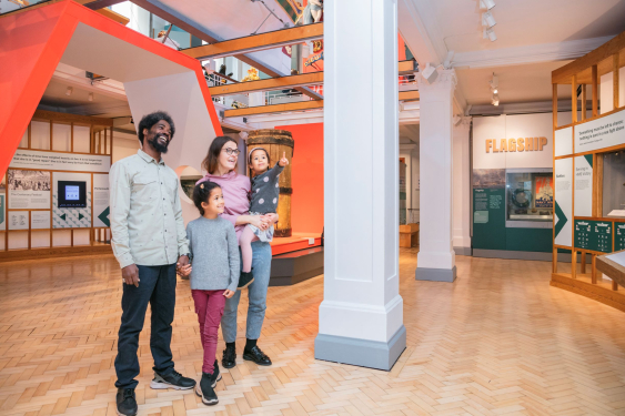 A family exploring the Victory Gallery.