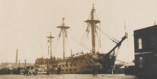 HMS Victory in drydock at Portsmouth with partial masts. 