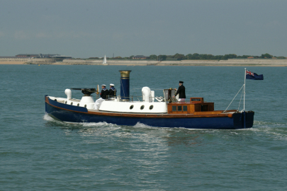 Steam Pinnace 199 sailing along the coast. 