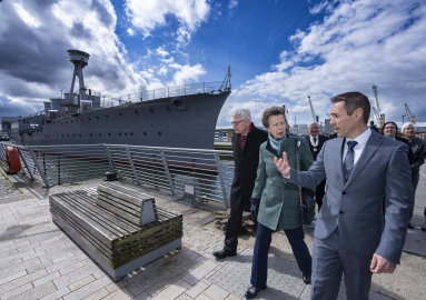 Princess Anne walking towards HMS Caroline in Belfast. 