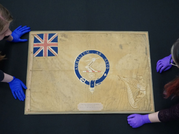 The polar Kellett sledge flag on a black background. 