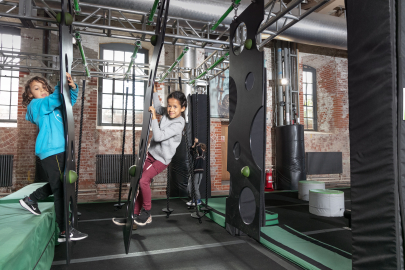 Children climbing on an assault course.