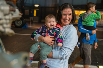Mother and child smiling at the Fleet Air Arm Museum. 