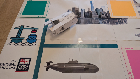 A small paper robot on a coding activity at the National Museum of the Royal Navy. 
