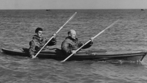 Archive photograph of Hasler and Stewart paddling a canoe at sea