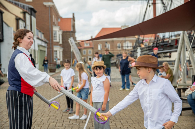 Children learning how to sword fight with our pirate costume interpreters.. 