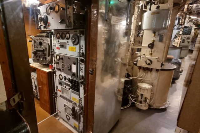 The wireless office onboard HMS Alliance is full of dials and controls. 