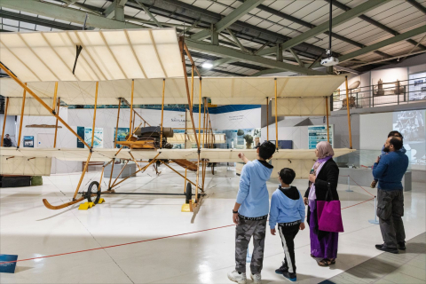 A family look at an early aircraft on display at the Fleet Air Arm Museum. 