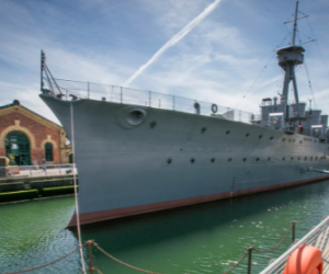 HMS Caroline at birth in Belfast on a sunny day. 