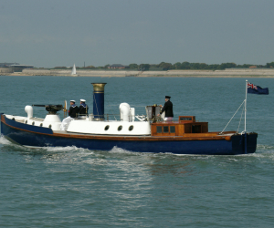 Steam Pinnace 199 sailing along the coast. 