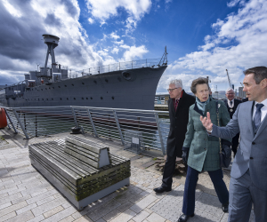 Princess Anne walking towards HMS Caroline in Belfast. 