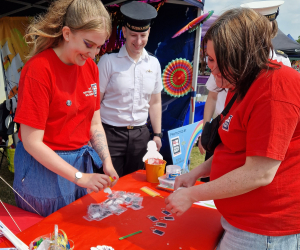 National Museum of the Royal Navy volunteers and Royal Naval personnel volunteering at a Pride stall. 