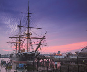HMS Warrior 1860 at dusk at Portsmouth Historic Dockyard.