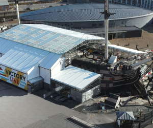 HMS Victory covered in the protective scaffolding of Victory Live. 