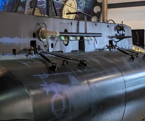 The untold stories logo next to the X24 submarine