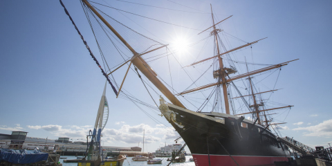 HMS Warrior floats at the entrance of Portsmouth Historic Dockyard.