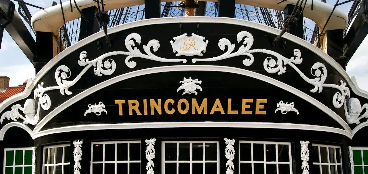 The lettered nameplate for HMS Trincomalee found across her stern. 